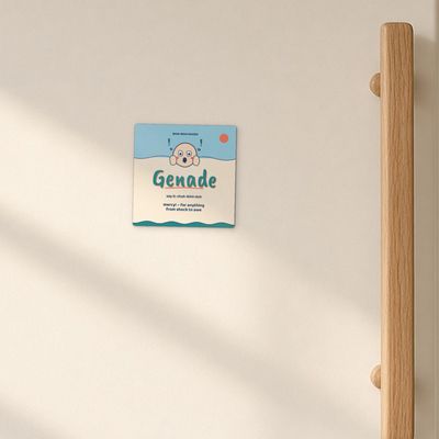 Genade magnet (Seaside): Cream enamel fridge door in morning window light, oak handle