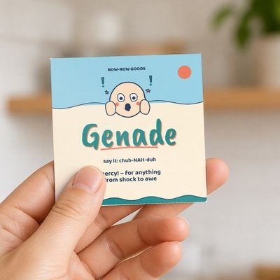 Genade magnet (Seaside): Hand holding the magnet in a bright kitchen (no face)