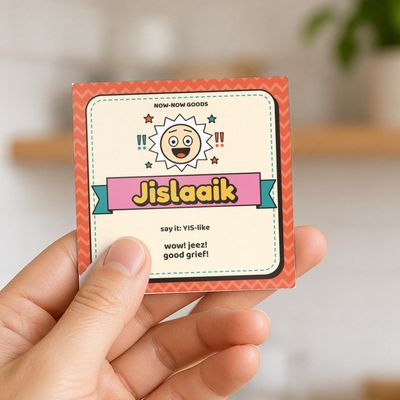 Jislaaik magnet (Sunny Mix): Hand holding the magnet in a bright kitchen (no face)