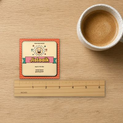 Jislaaik magnet (Sunny Mix): Top-down on oak with inch ruler (real marks), coffee mug and kraft paper
