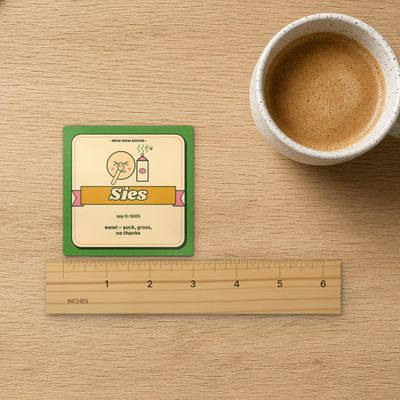 Sies magnet (Veld): Top-down on oak with inch ruler (real marks), coffee mug and kraft paper