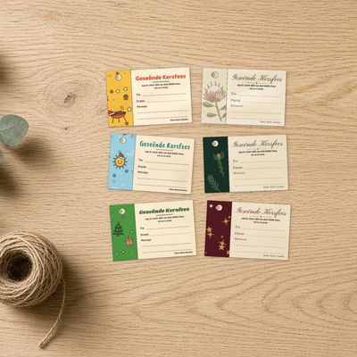 Digital printable gift tags: Flat lay of one tag in each of the 6 designs on oak, eucalyptus and twine at the edge